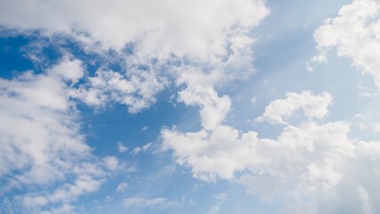 Wall Mural - Light blue sky with natural white fluffy clouds