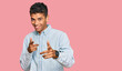 © Krakenimages.com - Young handsome african american man wearing casual clothes pointing fingers to camera with happy and funny face. good energy and vibes.