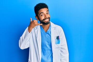 Poster - Handsome young hispanic business man wearing doctor uniform making fish face with lips, crazy and comical gesture. funny expression.