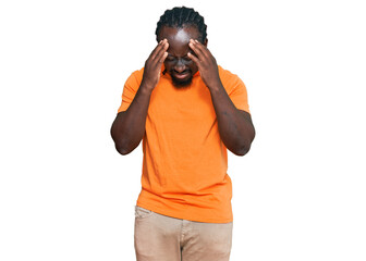 Canvas Print - Handsome young african american man wearing casual clothes with hand on head for pain in head because stress. suffering migraine.