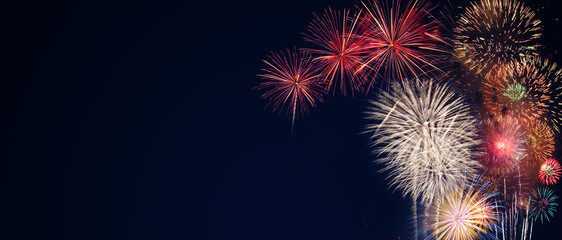 Canvas Print - colorful fireworks on the black sky background with free space for text. Celebration and anniversary concept