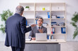 © Elnur - Old and young businessmen in business meeting concept