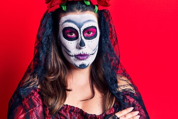 Poster - Young woman wearing day of the dead costume over red happy face smiling with crossed arms looking at the camera. positive person.