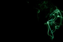 Green Smoke Against Black Background