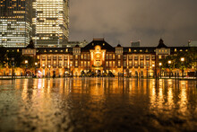 Rainy Tokyo Marunouchi / Buildings Reflected In A Puddle / Beautiful Water Surface