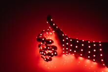 Thumbs Up Hand Covered With Red Led Lights, Illuminated Background
