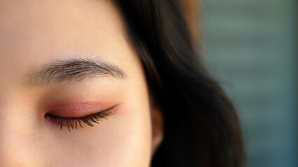 Close up, eye with pink eyeshadow. asian woman. High quality photo