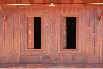 Canvas Print - Open window. Thai style wooden windows on brown wood wall background