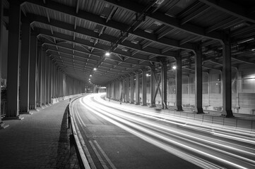 Poster - light trails and head lights of traffic in tunnel