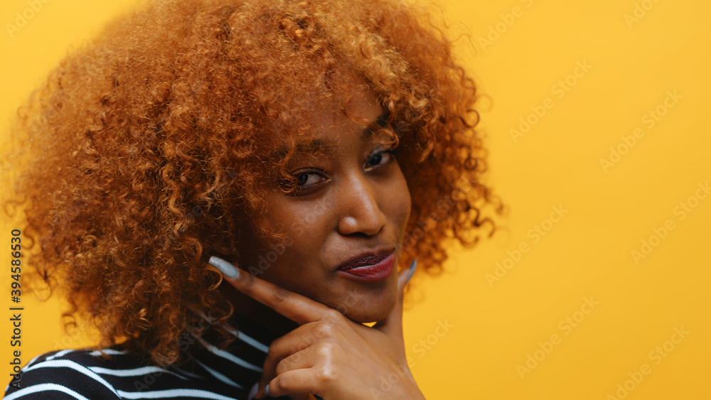 Young african american black woman with curly afro hair and long nails ...