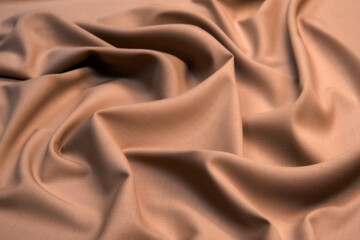 Smooth elegant brown silk satin textured fabric for using as abstract background for design.