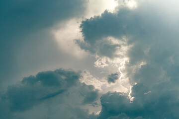 Wall Mural - gray sky and fluffy clouds with sunlight. cloudy sky. background for death and sad concept. sad and 