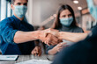 © yurolaitsalbert - close up. financial partners are shaking hands with each other .