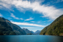 Mountain Range Spectacular And Exquisite Water Views In The Remote Wilderness Of The Deep Cove On A Beautiful Summer Morning At Doubtful Sound In New Zealand, South Island.