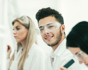 close up.a group of young scientists in the laboratory