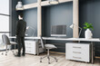 © Who is Danny - Businessman looking to window in modern conference interior
