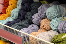 Counter In Shop For Knitting And Needlework With Coils Colored Wool Yarn. Different Color Threads On Rows In The Store. Retail Trade Of Goods For Hobby, Needlework And Knitting.