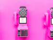 pink coin payphone on pink wall