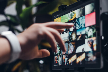 Close-up of using a tablet/laptop at home. Technology/Digital/Networking moment (*all photos on the screen are mine)