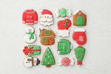 Wall Mural - Different Christmas gingerbread cookies on white wooden table, flat lay