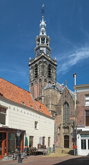 Tower and fragment of facade of Sint Janskerk (St John the Baptist Church) in Gouda, Netherlands. The church was built during the 15th and 16th centuries.