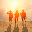 © arsenypopel - Silhouette Of A Solider Saluting Against the Sunrise in desert . Concept - armed forces of Islam countryes UAE,Turkey, Egypt