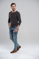 Sticker - Full length studio portrait of casual young man in jeans and shirt. Isolated on white background.