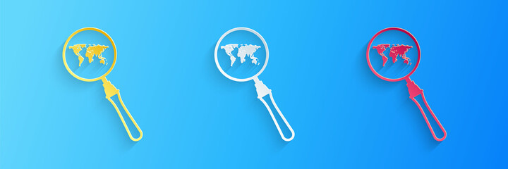 Poster - Paper cut Magnifying glass with world map icon isolated on blue background. Analyzing the world. Global search sign. Paper art style. Vector.