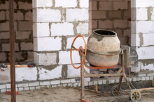 Manual Concrete Mixer At A Construction Site.