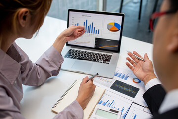 Team of business people working together in the meeting room office,
teamwork background charts and graphs banner, double exposure successful teamwork,business planning concept.
