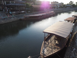 Traditional wooden boat on Uji river in Uji town neat Kyoto in Japan in summer