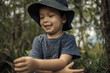 © Brayden Howie/Austockphoto - Mixed race boys bushwalking wearing hats in Barrington Tops National Park