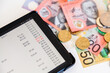 © Clare Seibel-Barnes/Austockphoto - Digital budget and cash banking and expenditure concept