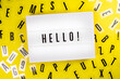 Hello! word on lightbox on scattered letters background of plastic alphabet. Greeting, meeting of guests, reception of visitors, sports competition, opening concept