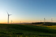 © Rosalie Dibben/Austockphoto - wind turbines in rolling farmland in late afternoon light