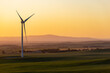 © Rosalie Dibben/Austockphoto - single wind turbine against golden afternoon sky