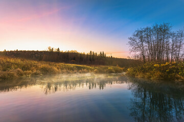 Wall Mural - Beautiful autumn morning in the woods with sunshine and fog from the river.