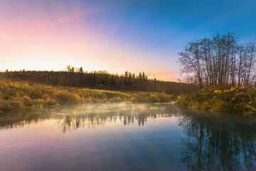 Canvas Print - Beautiful autumn morning in the woods with sunshine and fog from the river.