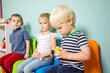 © oksix - The children watch each other with interest in the kindergarten