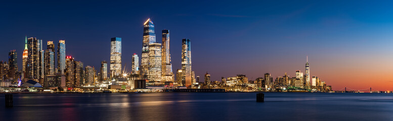 Fototapete - Manhattan West skyline at sunset. Skyscrapers of Hudson Yards and World Trade Center. Cityscape from across Hudson River, New York City, NY, USA