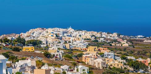 Wall Mural - A panorama view towards the village of Oia, Santorini in summertime