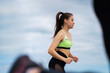 © Georgii - Athletic female running marathon. Sportive girl training outdoor. Active woman lifestyle