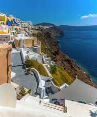 Wall Mural - A view along the caldera and the village of Oia, Santorini in summertime
