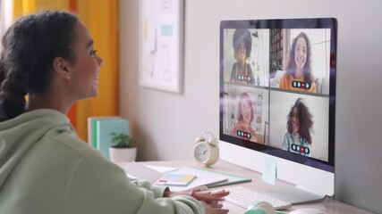 Wall Mural - African american teenage girl chatting with happy multiethnic diverse teen friends during online virtual chat video call in group conference distance chat virtual meeting using computer at home.