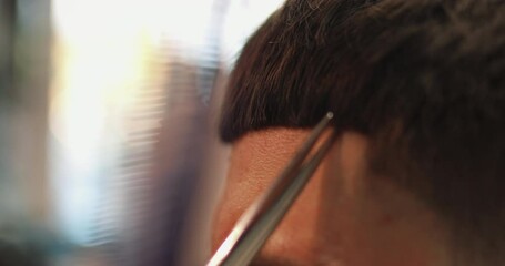 Wall Mural - Men's haircut with scissors. Close-up.