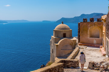 Wall Mural - Domes and castle walls on the northern tip of the village of Oia, Santorini in summertime