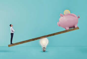 Wall Mural - Businessman uses lightbulb ad lever to lift piggybank. Concept of easy income with a good idea. Cyan background