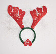 Sweetheart Christmas reindeer concept with snowflakes, on a snow-white background. Flat lay. Minimal winter holidays idea. 