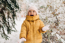 Toddler Girl Happy With Snow Day In Winter. Playing Outside On Christmas Holiday
