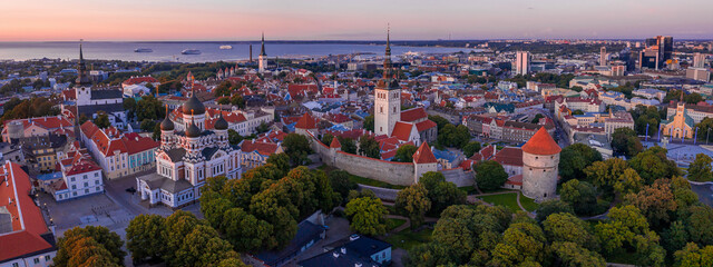 Wall Mural - Late afternoon sunset aerial view overlooking the medieval walled city of Tallinn Estonia on an early autumn day in the Baltics region of Northern Europe.